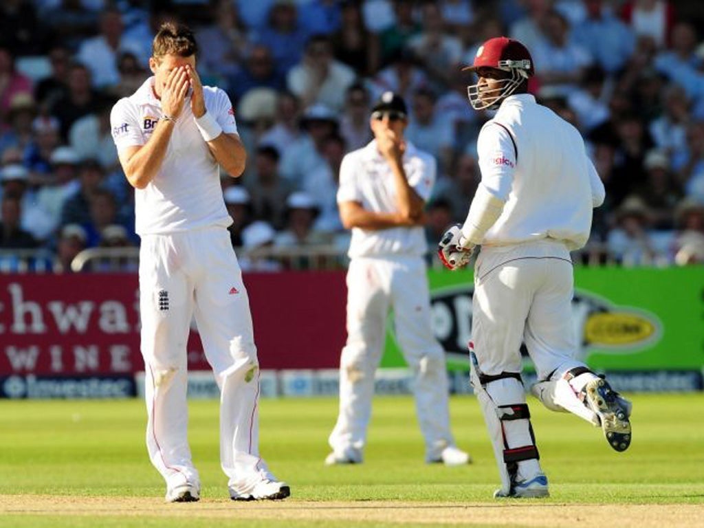 Jimmy Anderson cannot bear to look as Marlon Samuels piles on the runs