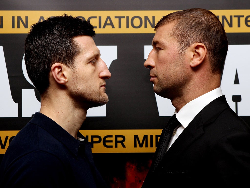 Carl Froch (left) squares up to Lucian Bute