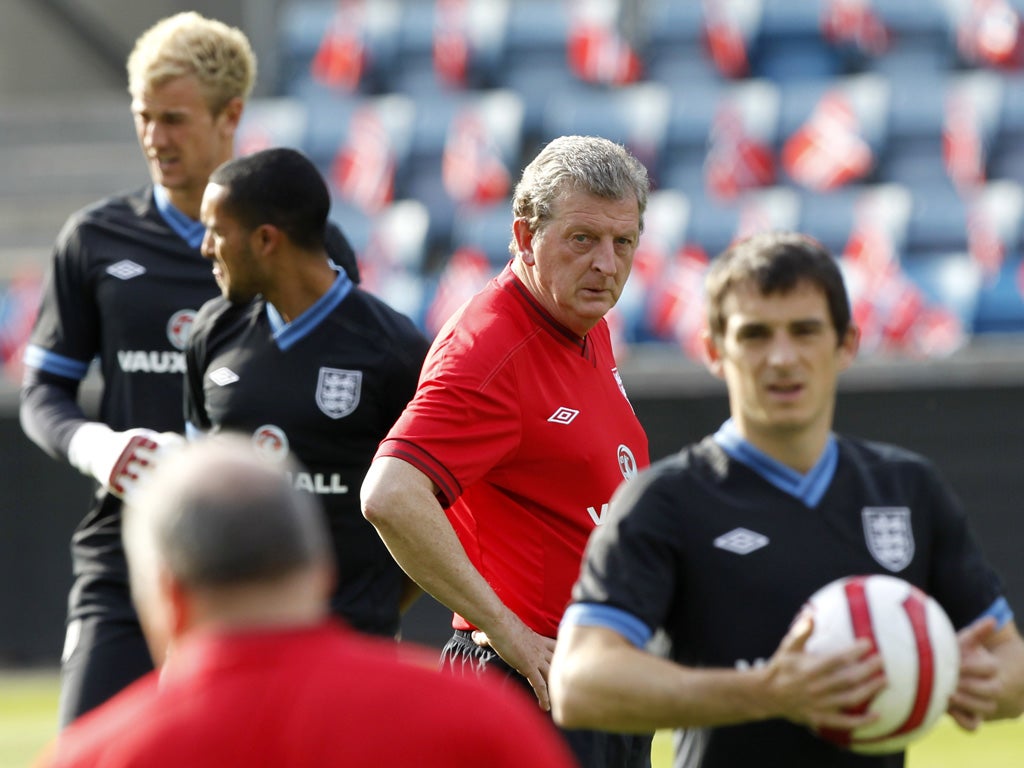Roy Hodgson keeps an eye on training in Oslo