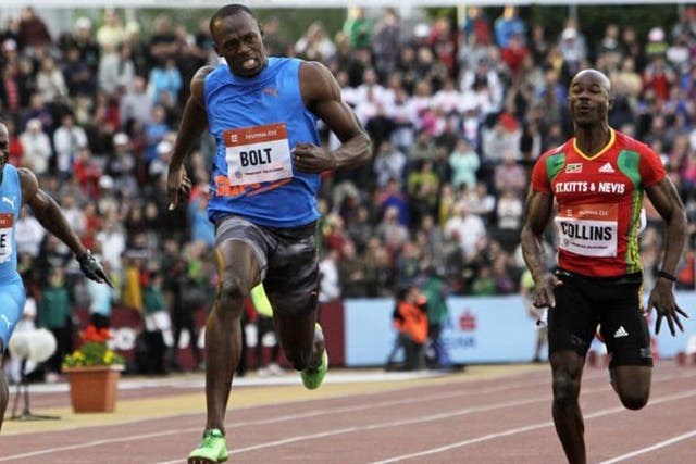 Usain Bolt (left) eased to victory in Ostrava last night