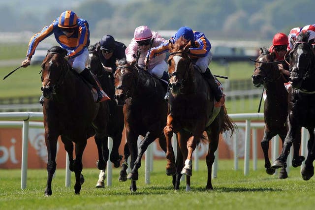Electric turn of pace: Power (left), ridden by Joseph O'Brien, quickens clear of his rivals in yesterday's Irish 2,000 Guineas at the Curragh