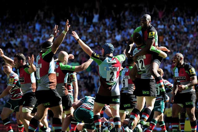 Mighty quins: Harlequins' players celebrate at the end of the Premiership final against Leicester