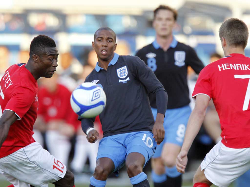 Ashley Young vies for the ball with Norway's Alexander Banor Tettey (left) and Norway's Markus Henriksen
