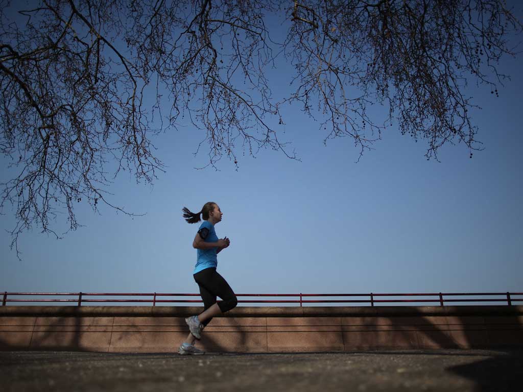 On the run: As budgets tighten, people take up cheaper activities such as jogging rather than golf or sailing