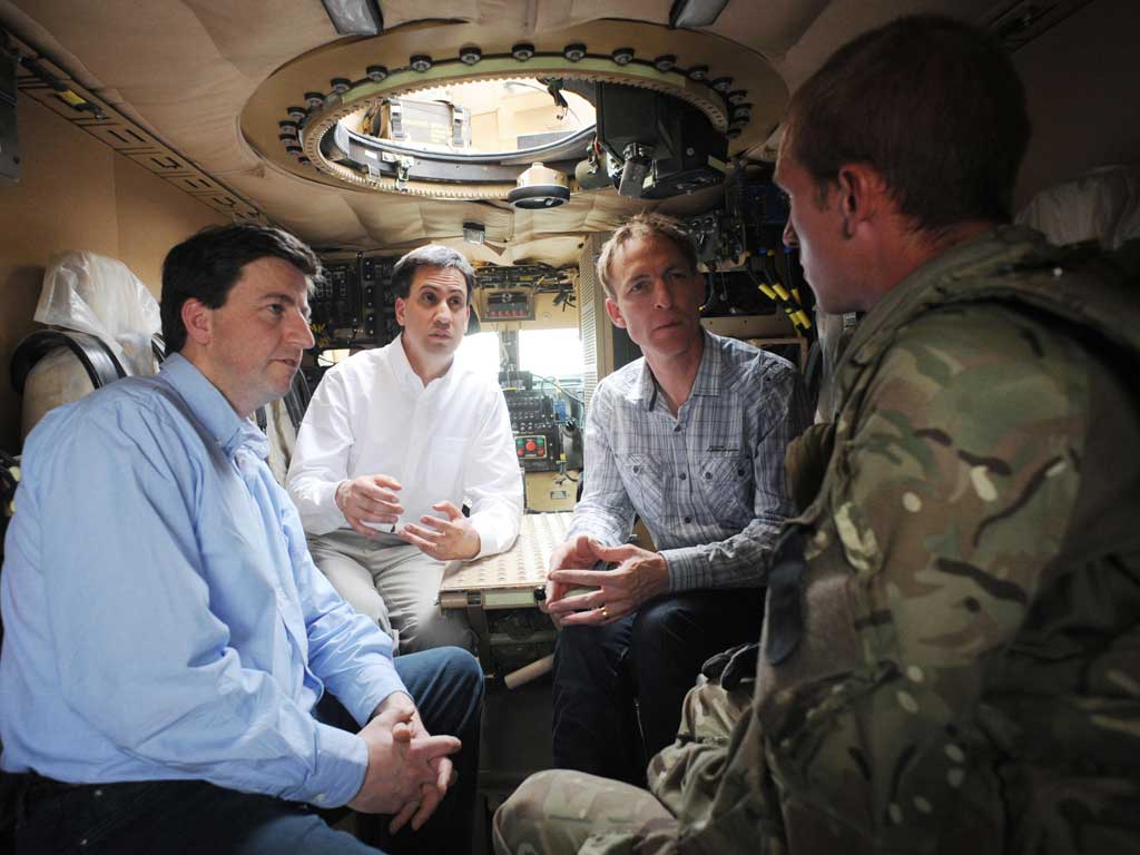 Troop talks: Ed Miliband, centre, with Douglas Alexander and Jim Murphy