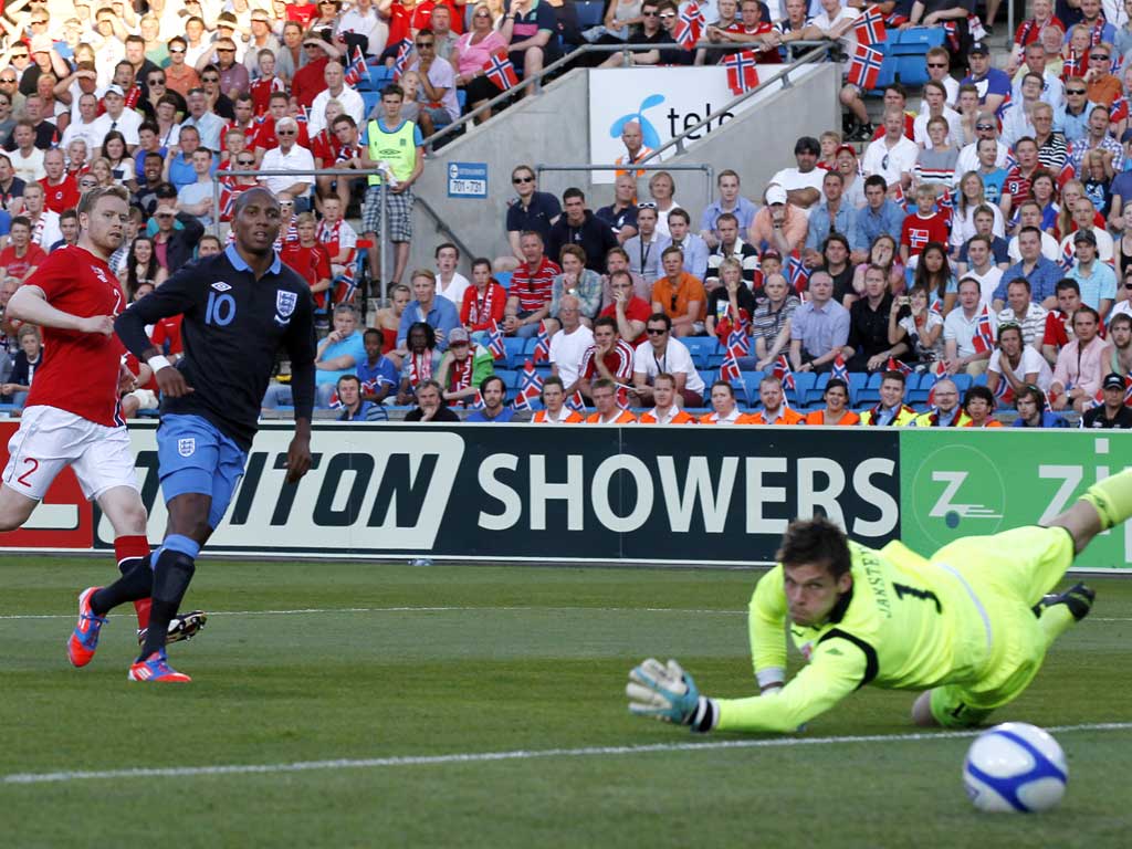 Having a ball: Ashley Young scores England's first goal under Roy Hodgson, against Norway at the Ullevaal Stadium in Oslo