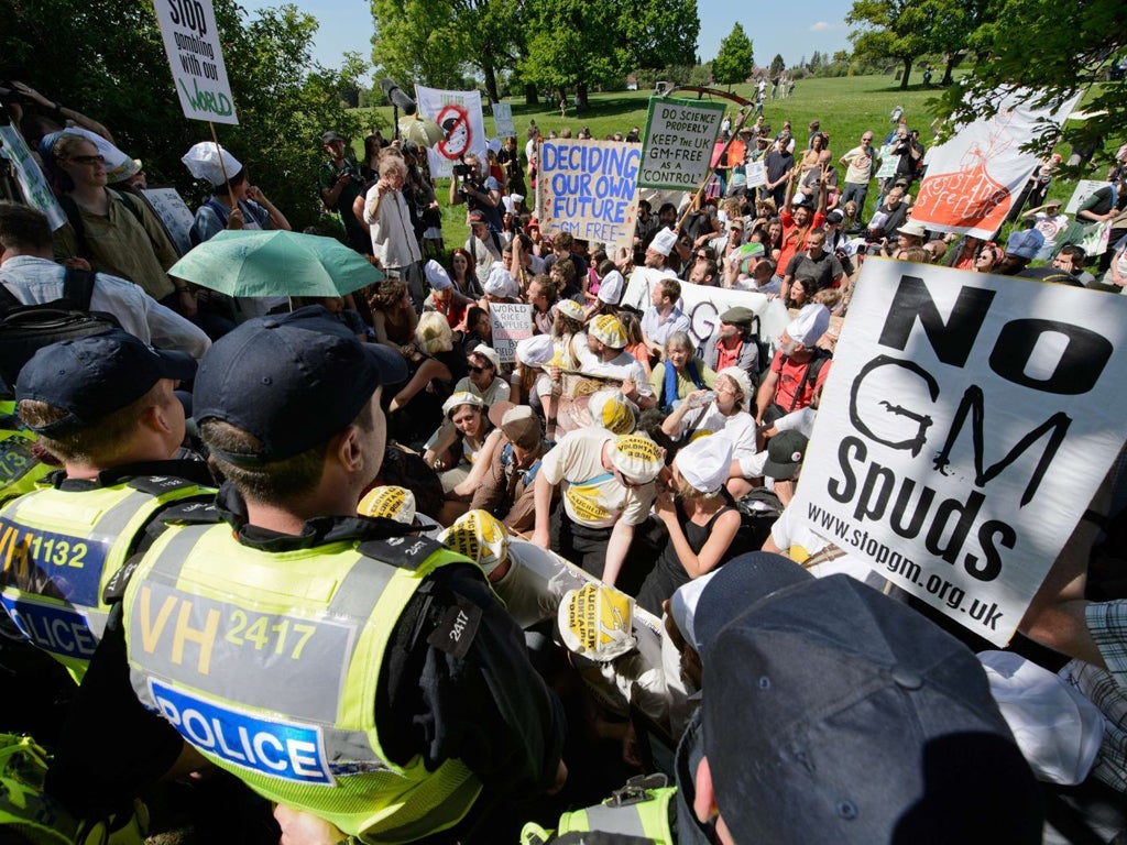Protesters stage a sit-in as they take part in a demonstration by the "Take the Flour Back" group in Harpenden, Hertfordshire, on May 27, 2012