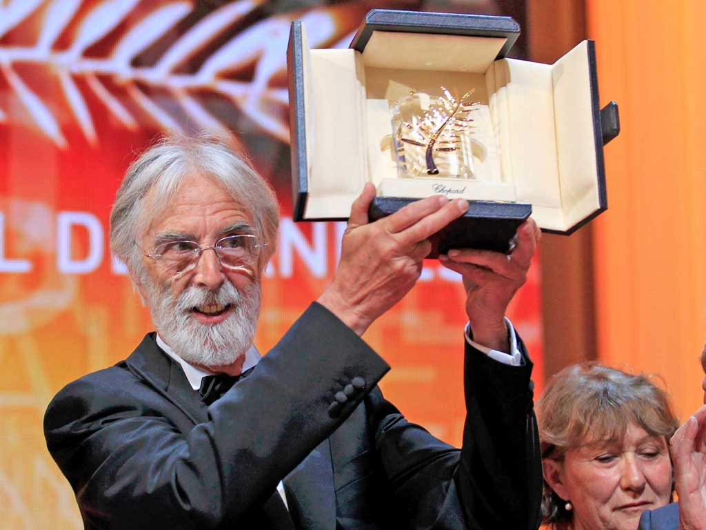 Director Michael Haneke receives the Palme d'Or award for the film "Amour" (Love) during the 65th Cannes Film Festival