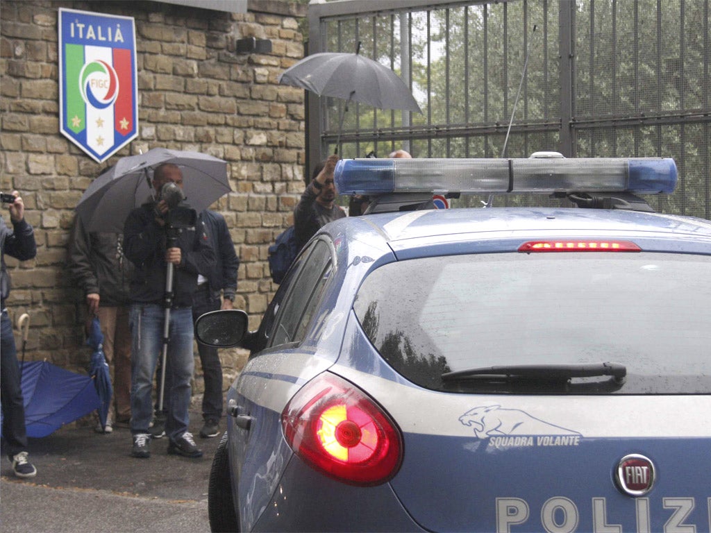 Police arrive at the Italian training camp on Monday morning