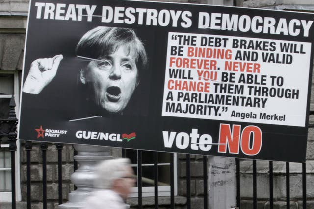 A sign for the No campaign in Dublin features German Chancellor Angela Merkel