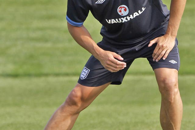 Phil Jagielka stretches during an England training session yesterday