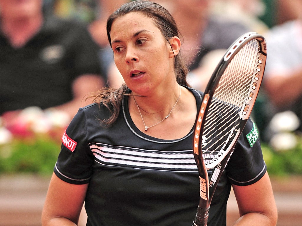 Marion Bartoli suffers in front of her home crowd yesterday