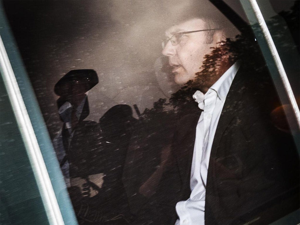 Andy Coulson arrives at a police station in Glasgow yesterday