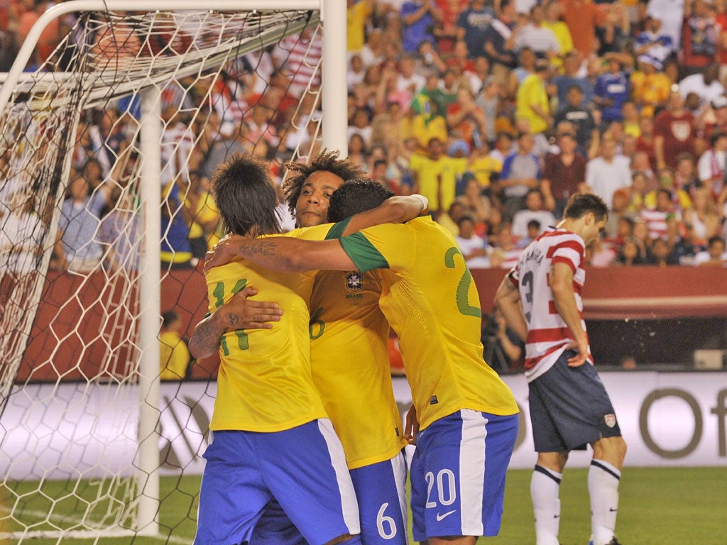 Brazil players celebrate Marcelo's goal