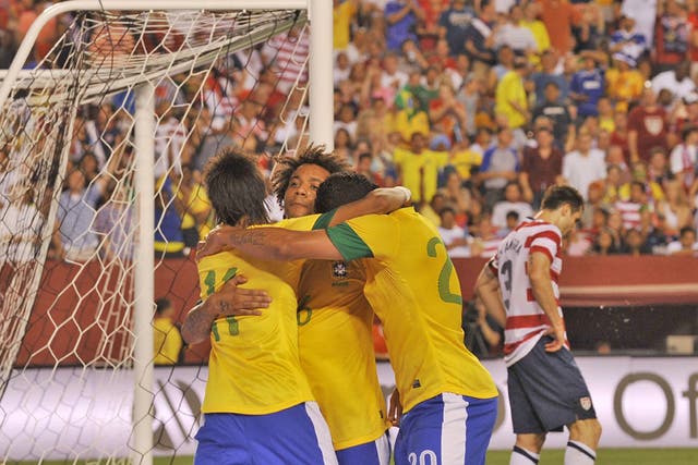 Brazil players celebrate Marcelo's goal