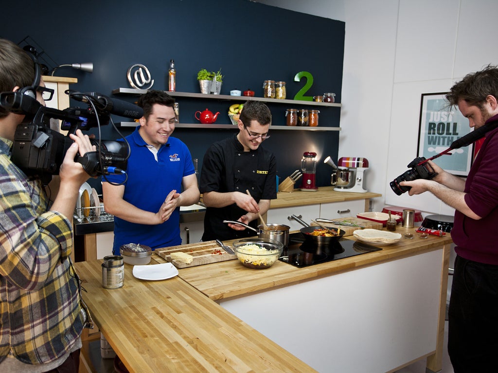 Kitchen boys: Tom Hemsley (far left) films Jamie Spafford (left) and Ben Ebbrell for their latest video for Sortedfood.com, their online cooking show, in their studio