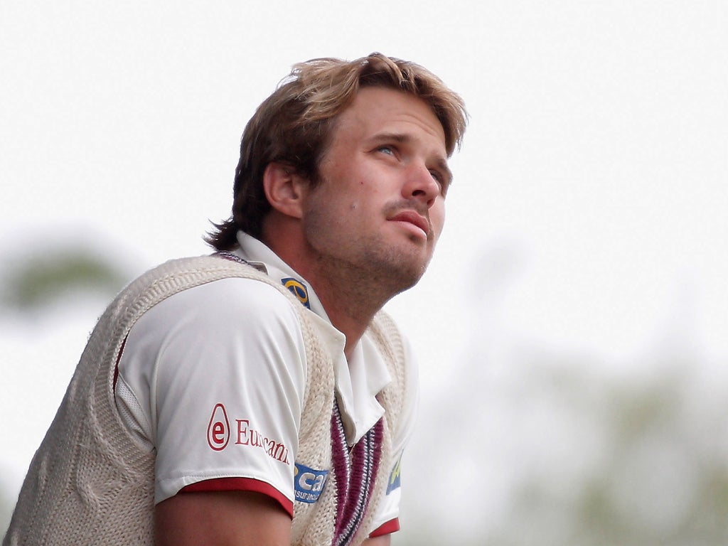 Nick Compton: The Somerset batsman watches the rain from the balcony at New Road yesterday
