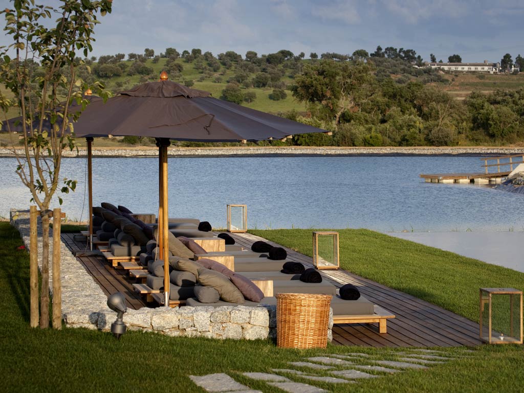 L'And, Portugal

<p>With eye-catching design, this all-suite resort opened on the outskirts of Evora last year. Each of the chic rooms mixes natural slate and stone with whitewashed walls and rolling views of the Alentejo hills. Guests can create their own blend at the winery – complete with personalised labels – or indulge in tutored tasting sessions of L'And's 2009 Touriga Nacional, Touriga Franca and Alicante Bouschet. There's also the chance to try regional pork and cheese dishes at the restaurant, or relax in the spa with 'vinotherapy' treatments, using grape-based products.</p>

<p>L'And, Estrada Nacional 4, Herdade das Valadas, Evora, Alentejo, Portugal (00 351 266 242 400; l-andvineyards.com). Suites start at €170, including breakfast.</p>