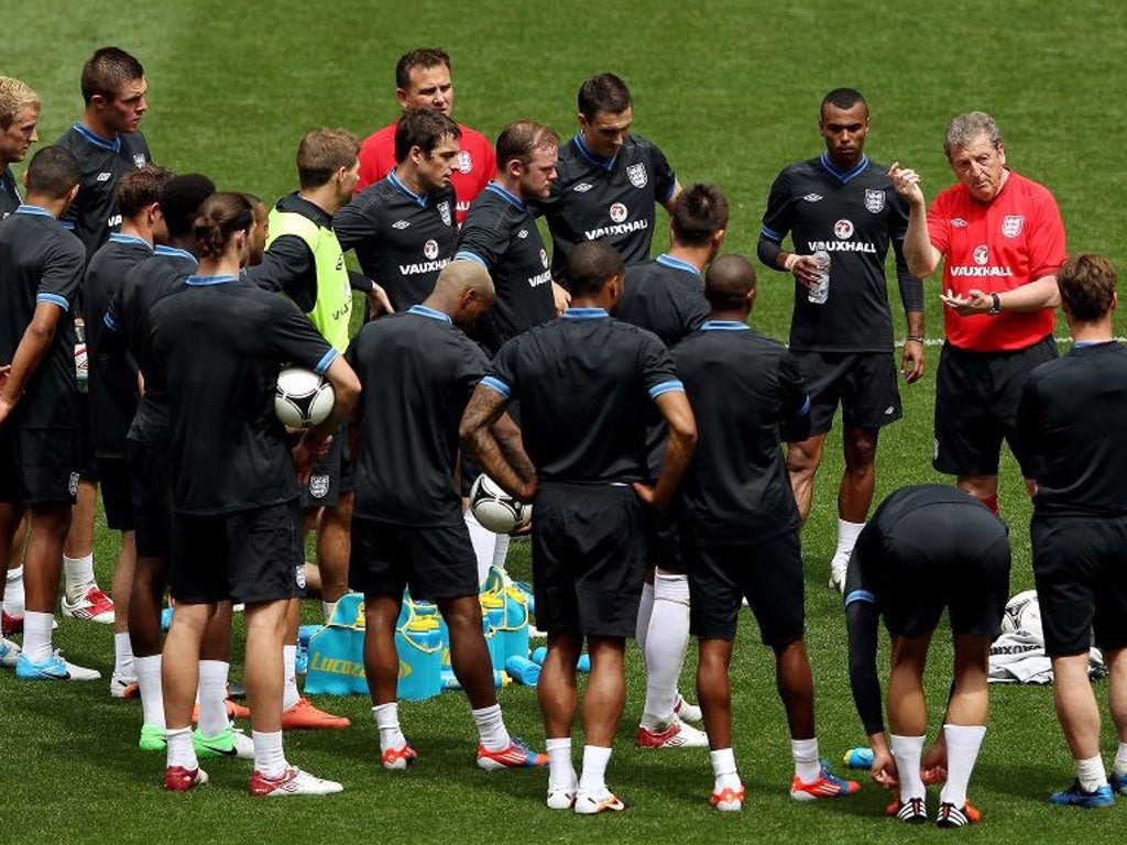 Roy Hodgson speaks to the England players during training at Wembley