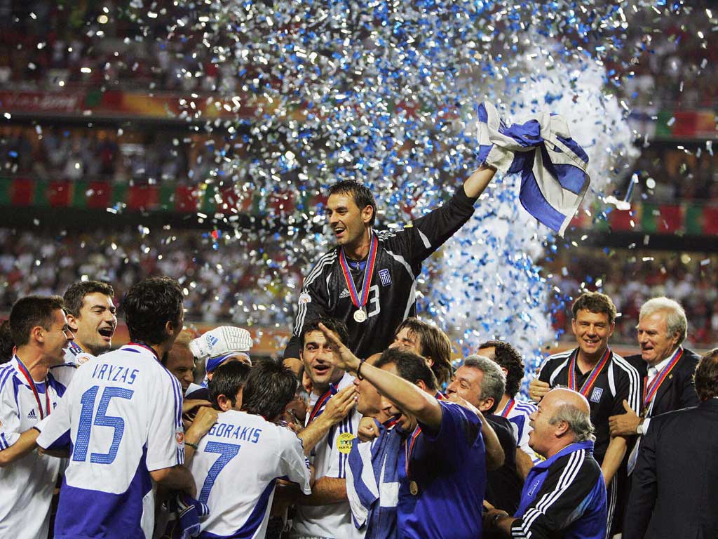 Party time: Greece players celebrate their unlikely triumph against hosts Portugal in the 2004 final in Lisbon, when they took the tournament by storm
