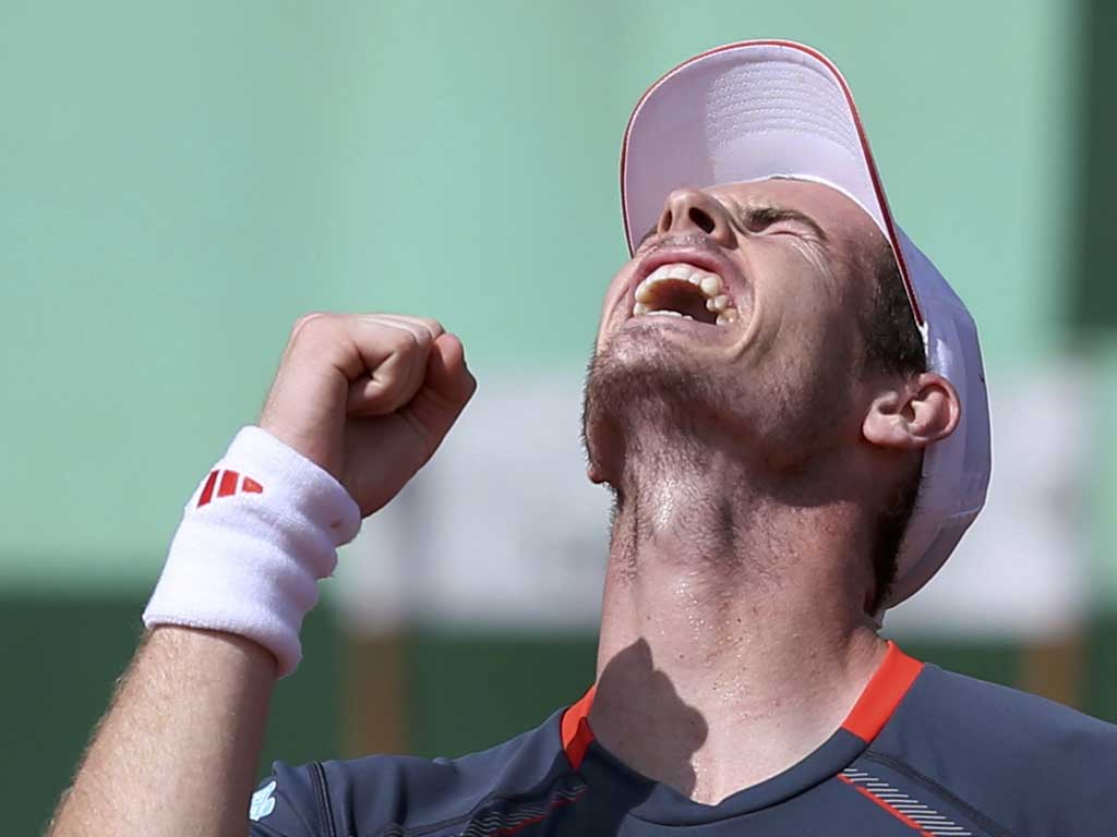 Back on course: Andy Murray is delighted after beating Santiago Giraldo in straight sets at Roland Garros