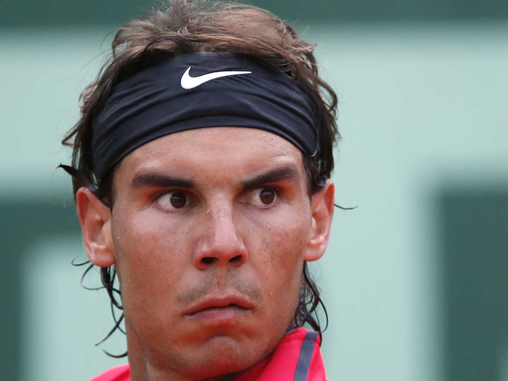 Sticky problem: Rafael Nadal does not like the feel of suntan lotion on him