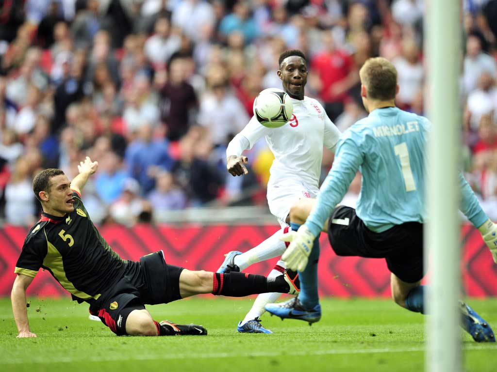 Danny Welbeck beats Simon Mignolet to score his first goal for England