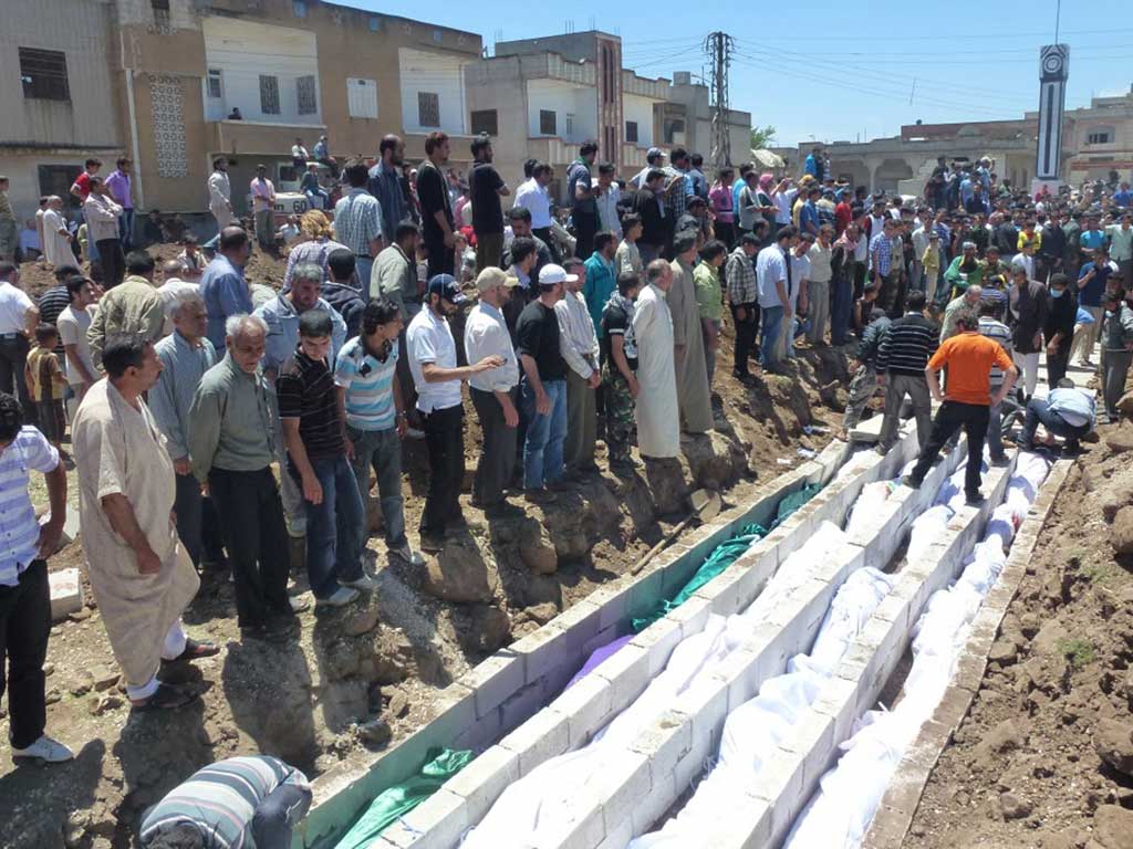 Massacre: The funeral last week of those killed in the city of Houla