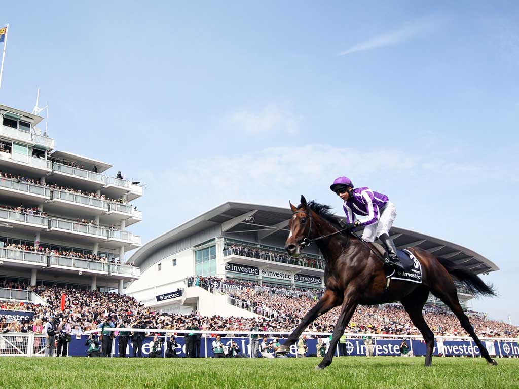 Camelot heads the field to win the Derby on the second day of
the Epsom festival
