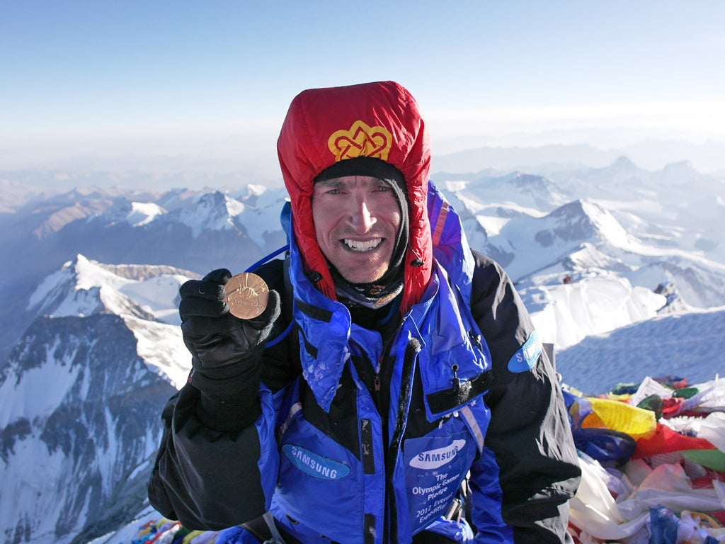 Kenton Cool on the summit of Everest for the tenth time, fulfilling a pledge to return a 1924 Olympic medal to the mountain, sponsored by Samsung