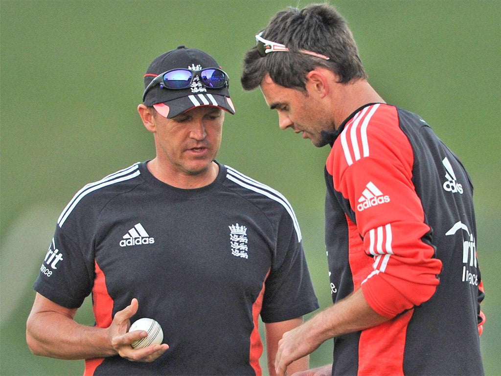 Andy Flower (left) speaks to bowler James Anderson during a nets session last year