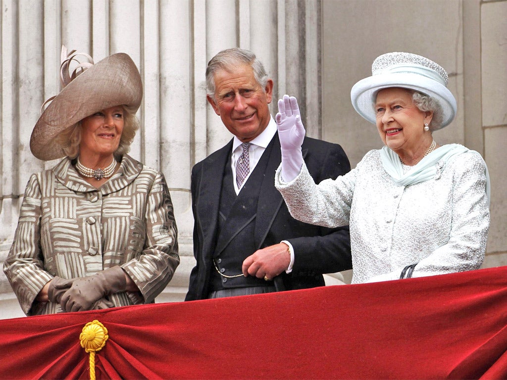 The Queen waves to the crowds from the Buckingham Palace balcony