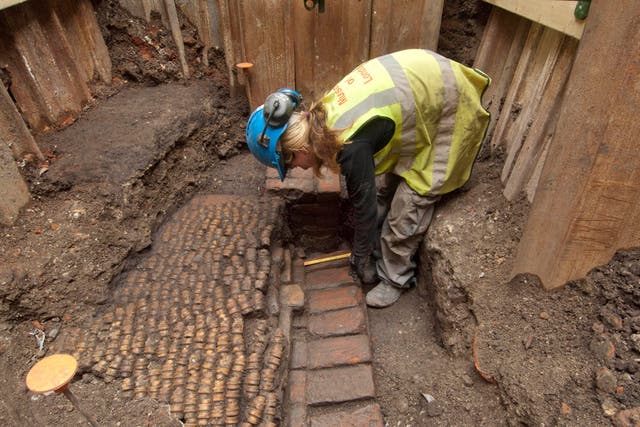 Archaeologists undertaking the initial excavation work at The Curtain Theatre