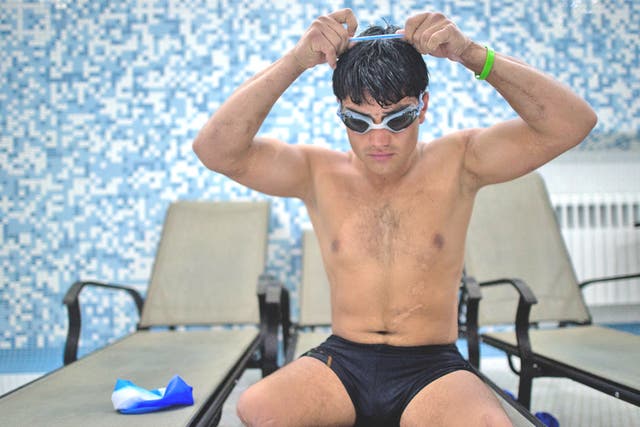 Malek Mohammed prepares for a training swim in Kabul