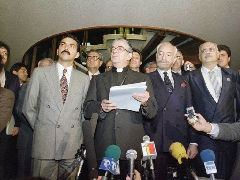 Justice for the poor: Quezada (second from left) leads Guatemalan peace talks in 1991