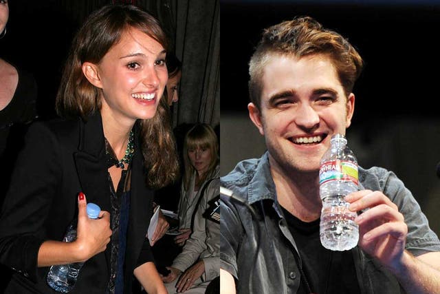 Taking the waters: Bottle-huggers Natalie Portman and Robert Pattinson