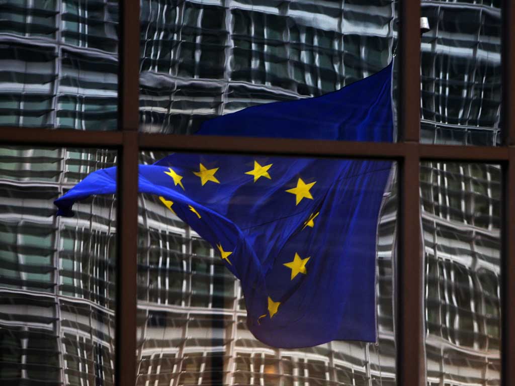 Fluttering: The European flag flies in Brussels, but David Cameron's direction is unclear