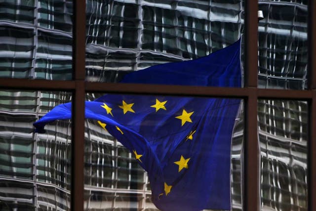 Fluttering: The European flag flies in Brussels, but David Cameron's direction is unclear