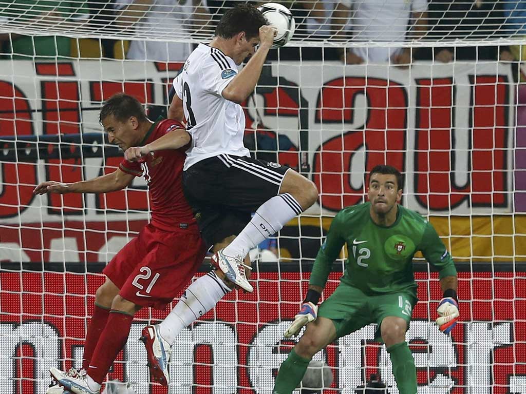 Heads up: A Mario Gomez header powers Germany ahead