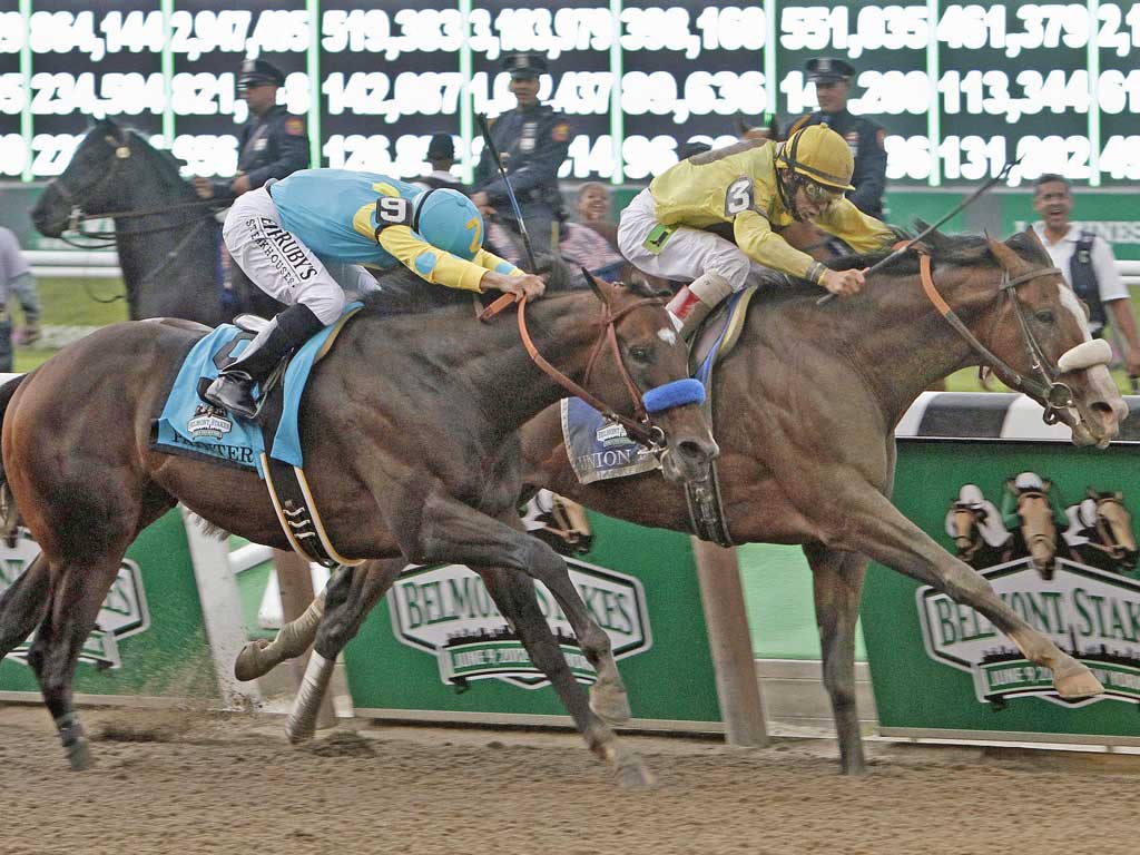 John Velazquez drives Union Rags (right) past Mike Smith on Paynter to win the Belmont Stakes