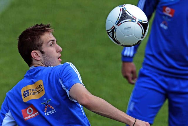 Greece’s Kostas Fortounis keeps his eye on the ball during training yesterday