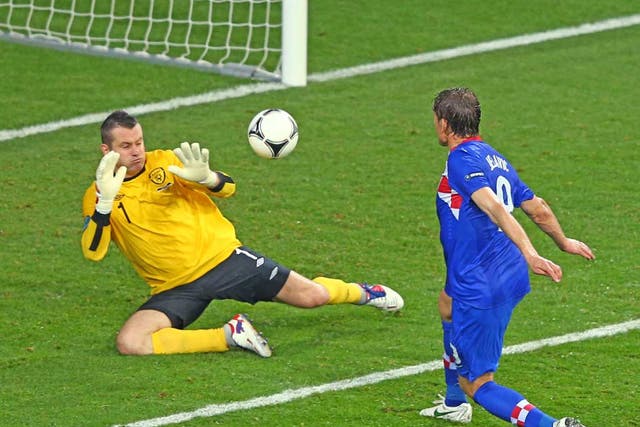 Croatia's Nikica Jelavic scores the 2-1 lead against Ireland goalkeeper Shay Given during the Group C preliminary round match of the UEFA Euro 2012