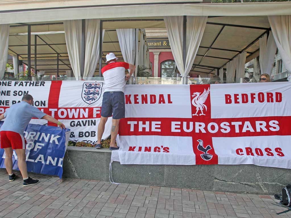 England fans put up banners at the Golden Lion