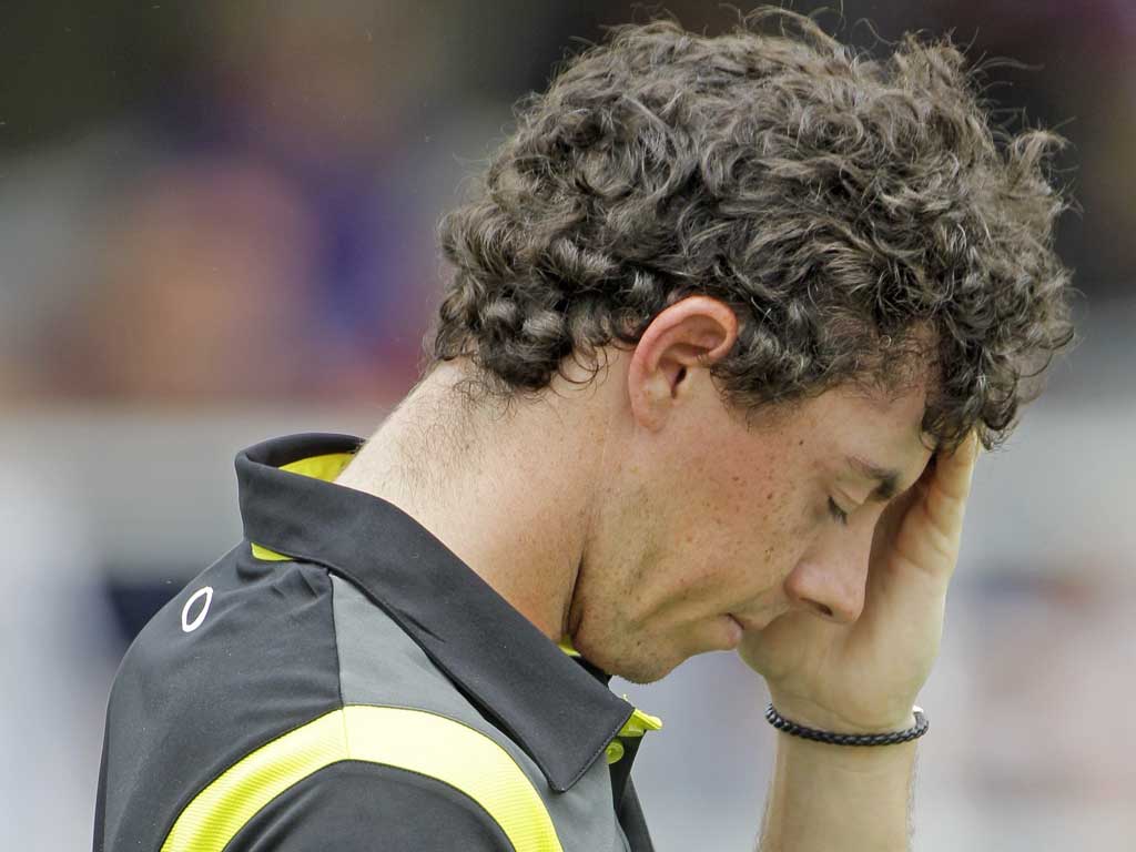 A disconsolate Rory McIlroy tries to come to terms with blowing his chances at the St Jude Classic last night