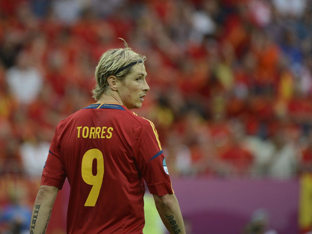 Torres pictured in the match against Italy
