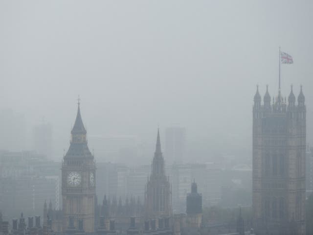 A picture shows the British Houses of Parliament seen through heavy fog and low cloud in London on June 11, 2012. Heavy rain fell over much of the south and central England on June 11, disrupting sporting events like the third Test at Edgbasten and the Ae