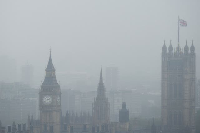 A picture shows the British Houses of Parliament seen through heavy fog and low cloud in London on June 11, 2012. Heavy rain fell over much of the south and central England on June 11, disrupting sporting events like the third Test at Edgbasten and the Aegon Championships and shrouding the captial in a pall of mist and fog.