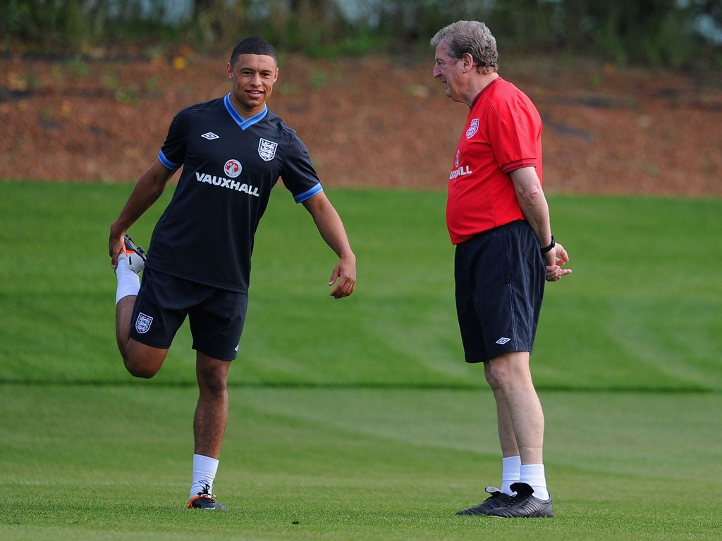 Alex Oxlade-Chamberlain with manager Roy Hodgson