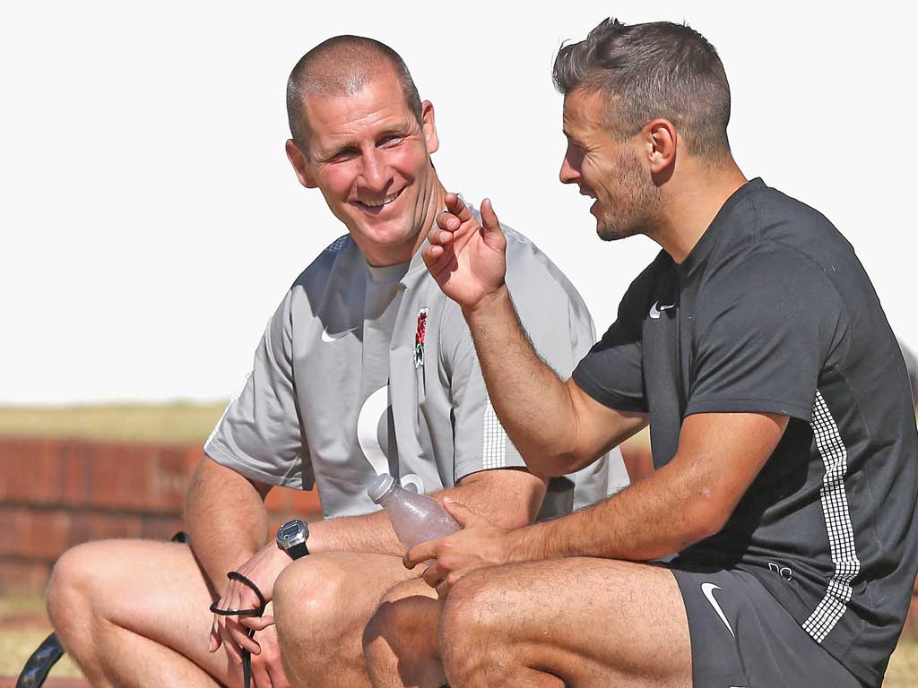 Stuart Lancaster (left) talks to Danny Care during training