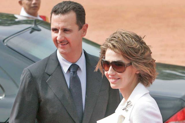 Syrian President Bashar al-Assad, left, and his wife Asma Assad